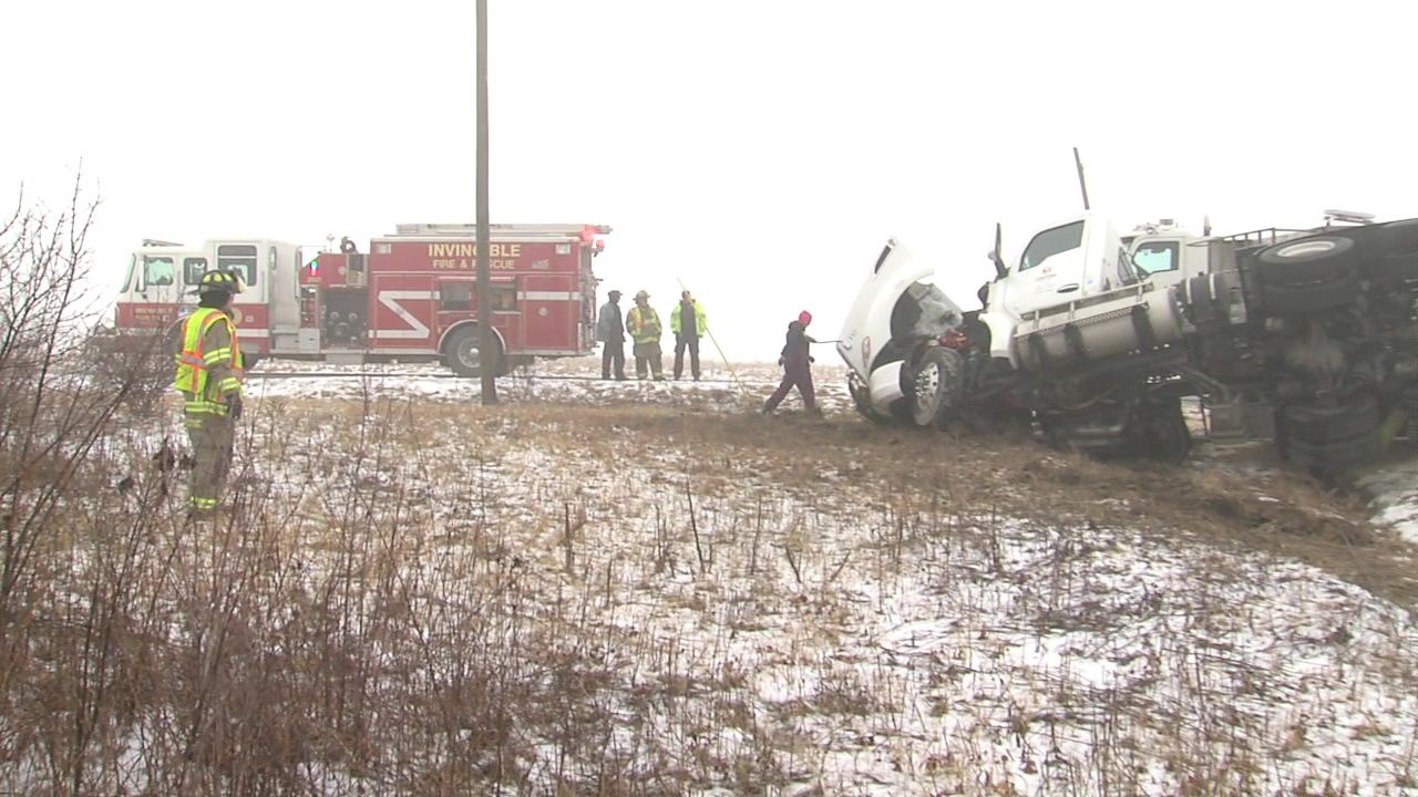 Driver transported to hospital after rolling semi truck 1.jpg